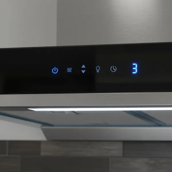 A close-up shot of the touch control panel and LED lighting on a Golden Vantage wall mount range hood.
